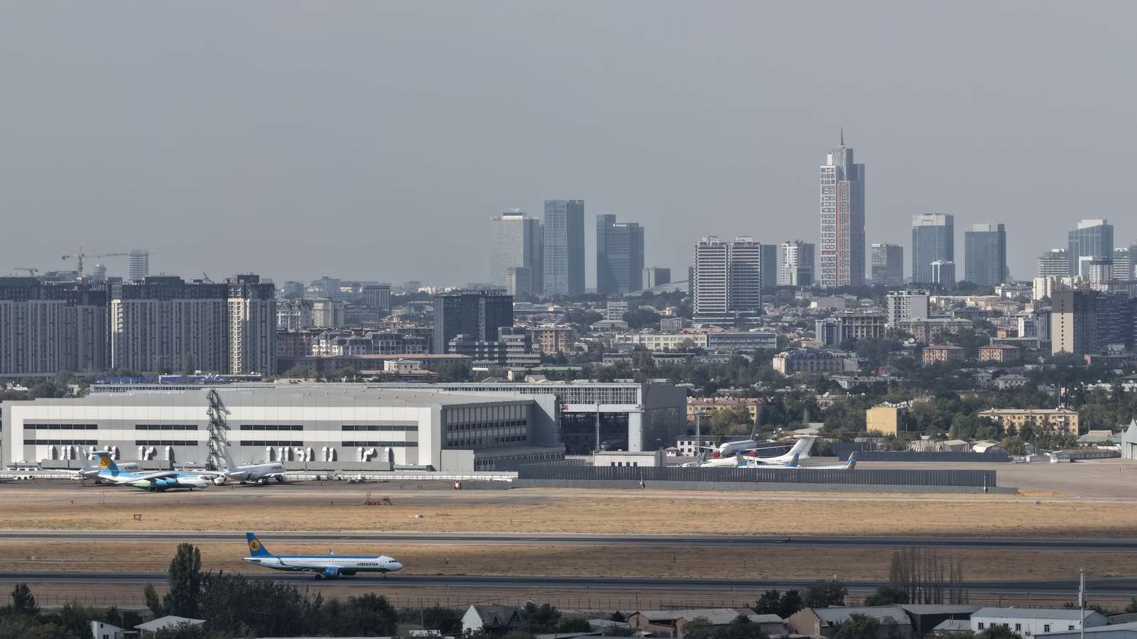 A plane on the runway at Tashkent International Airport