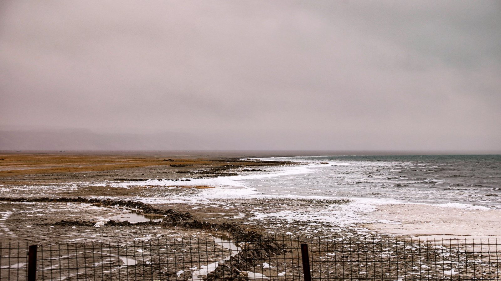 The Aral Sea shore under a cloudy sky