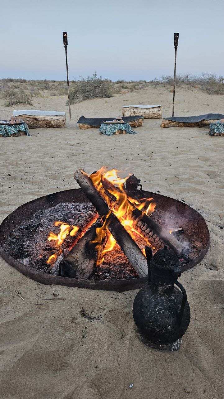 A campfire on the sand