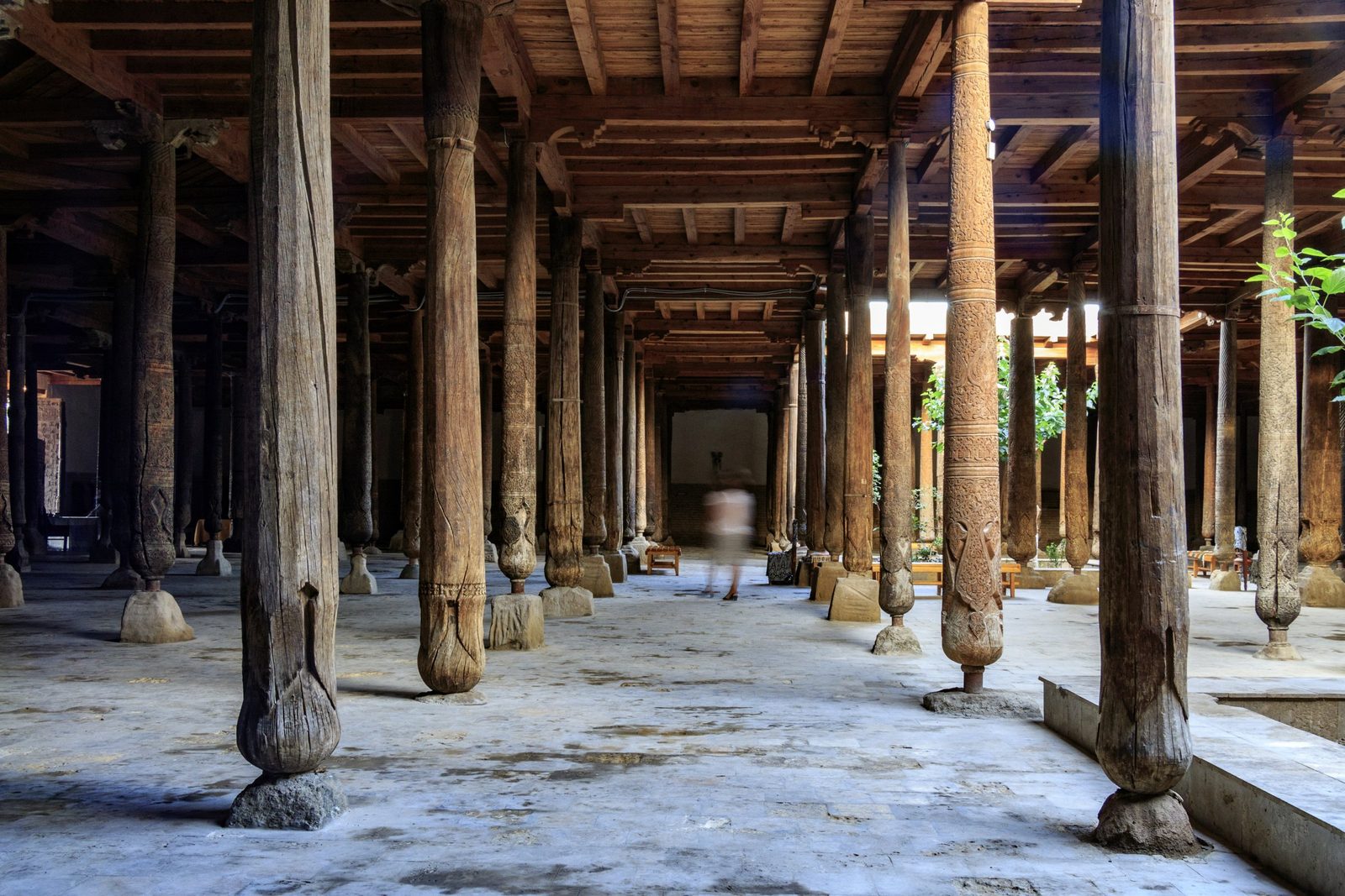 The hall of carved wooden columns in the Juma Mosque