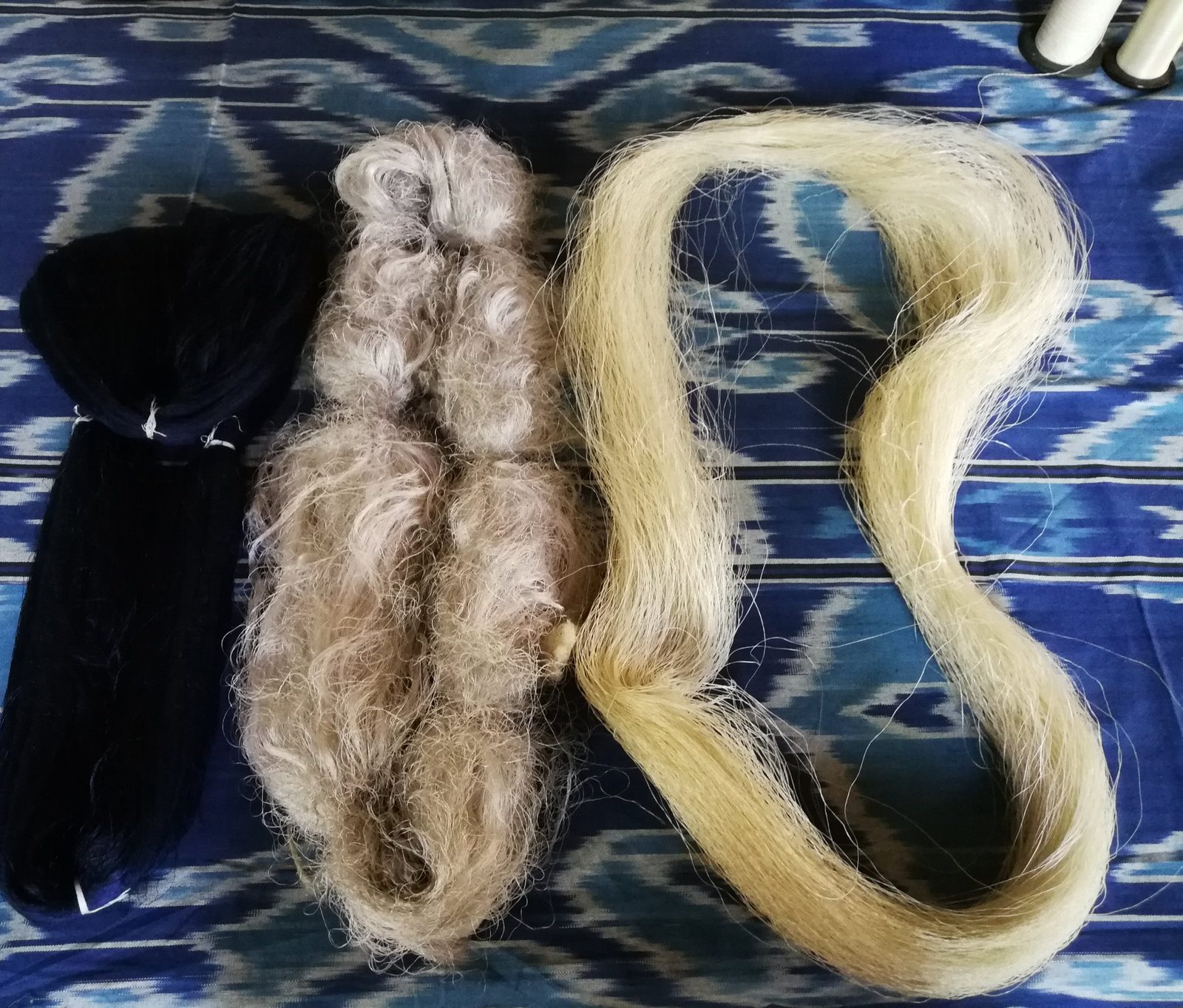Dyed silk, silk floss and reeled thread on a length of ikat