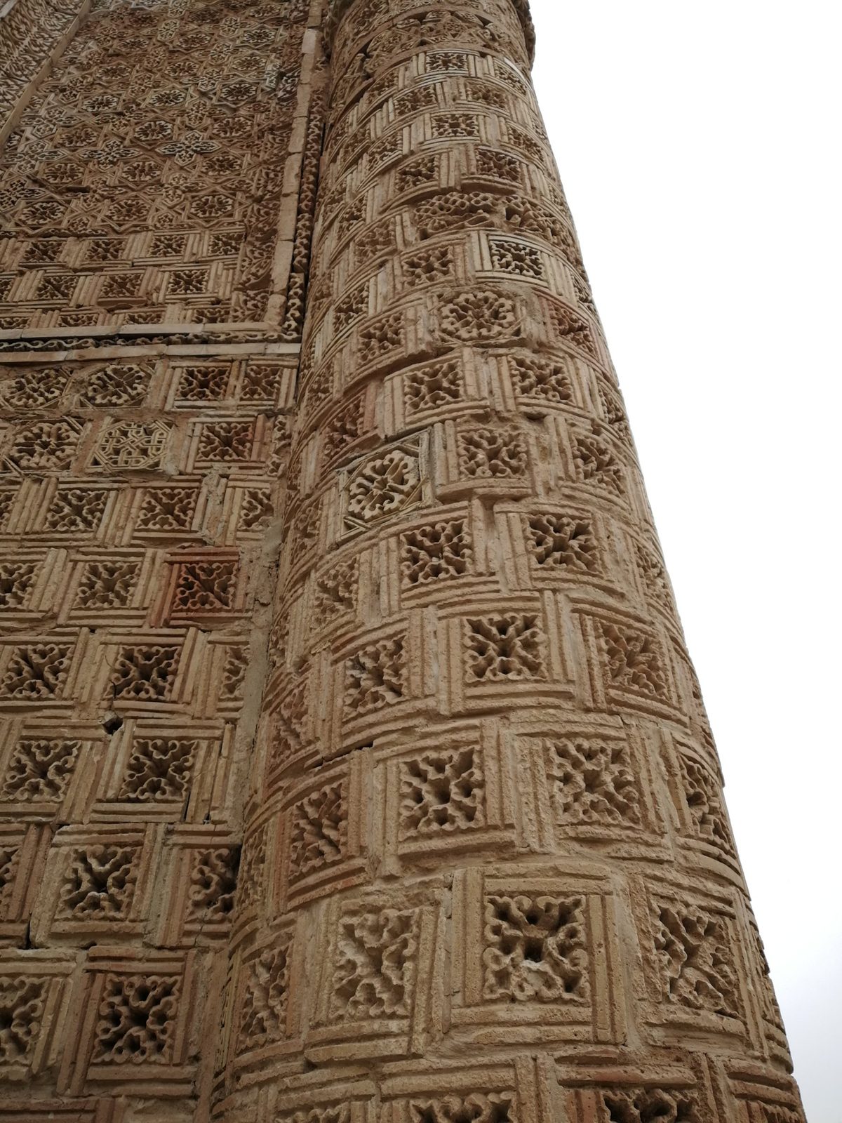 Carved terracotta tiles on a corner column of Aisha Bibi