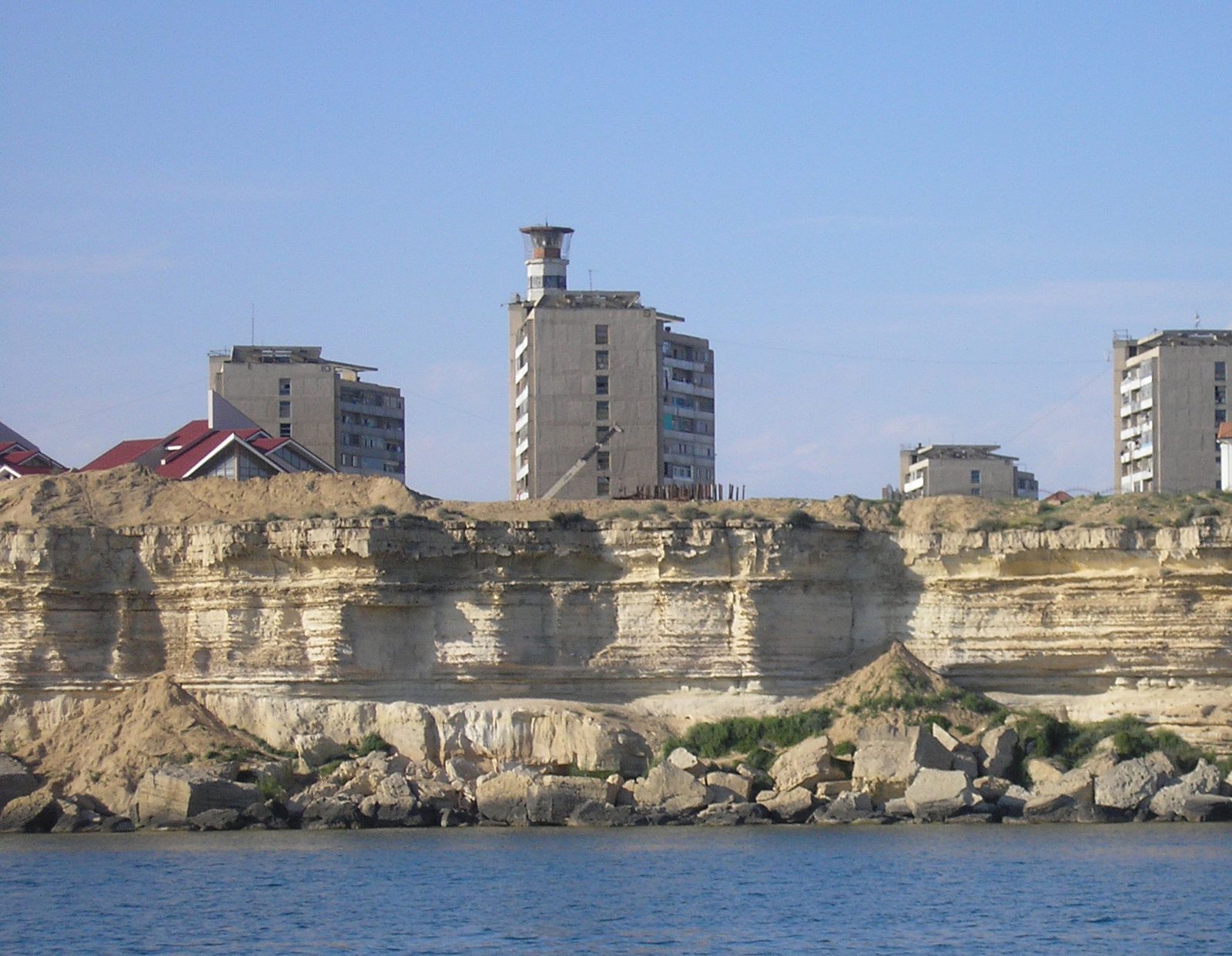 The lighthouse on the roof of an apartment block above the Caspian cliffs, Aktau
