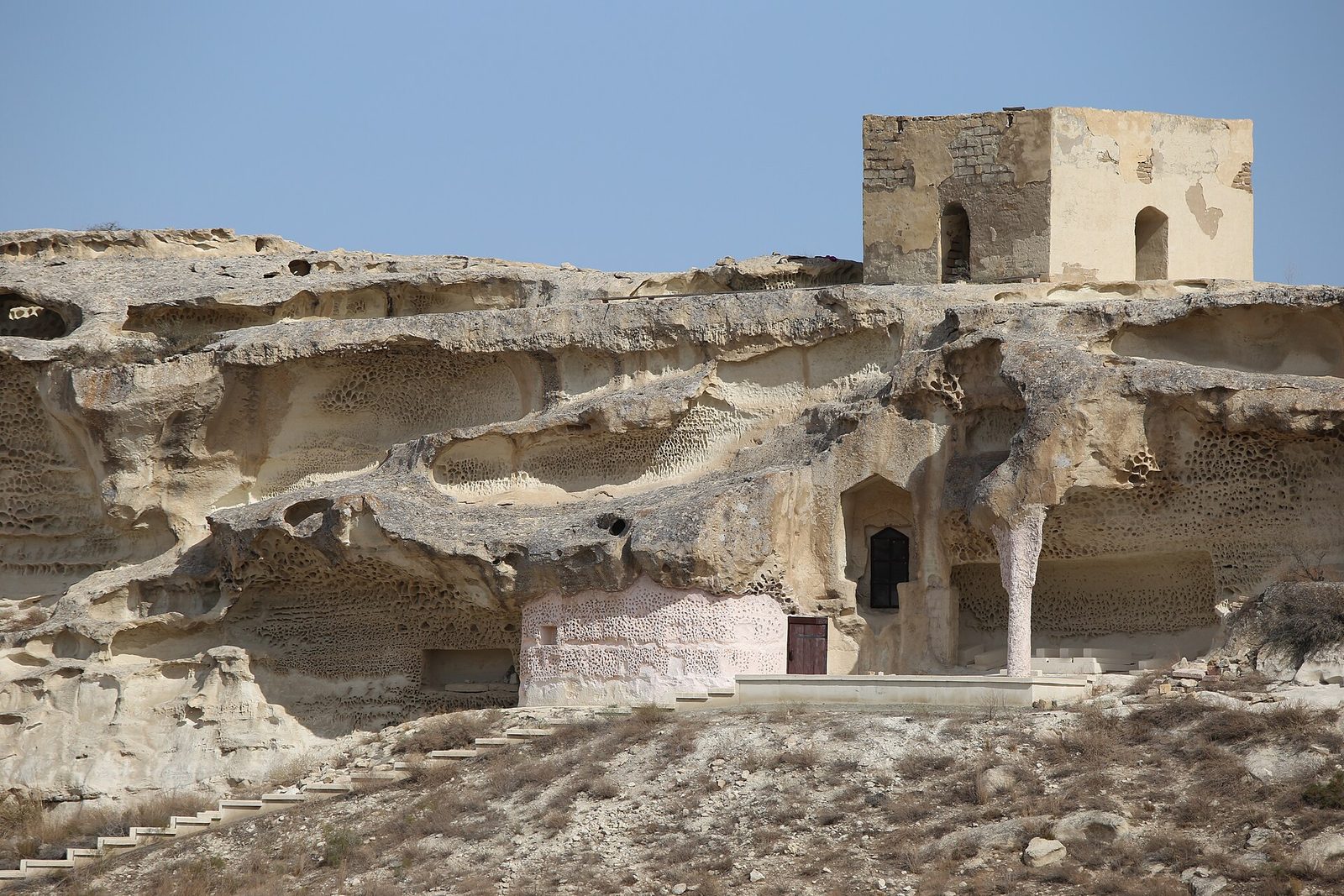 The rock-cut entrance of the Shakpak-Ata underground mosque, Mangystau